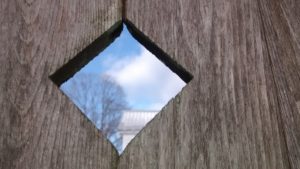 the sky through a diamond-shaped hole